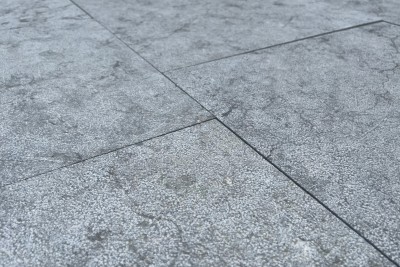 167 m² bush hammered Spanish limestone paving